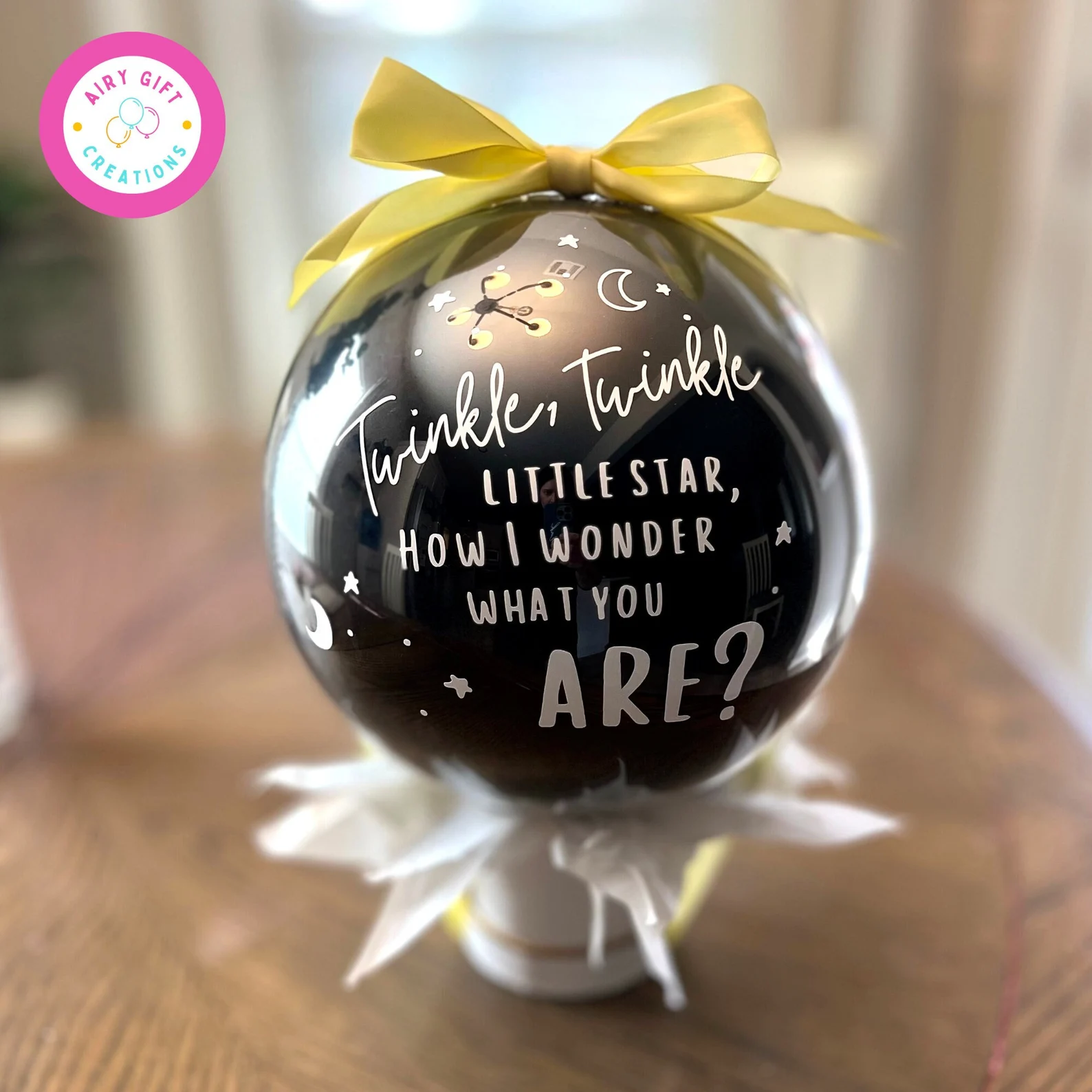 Black gender reveal balloon.