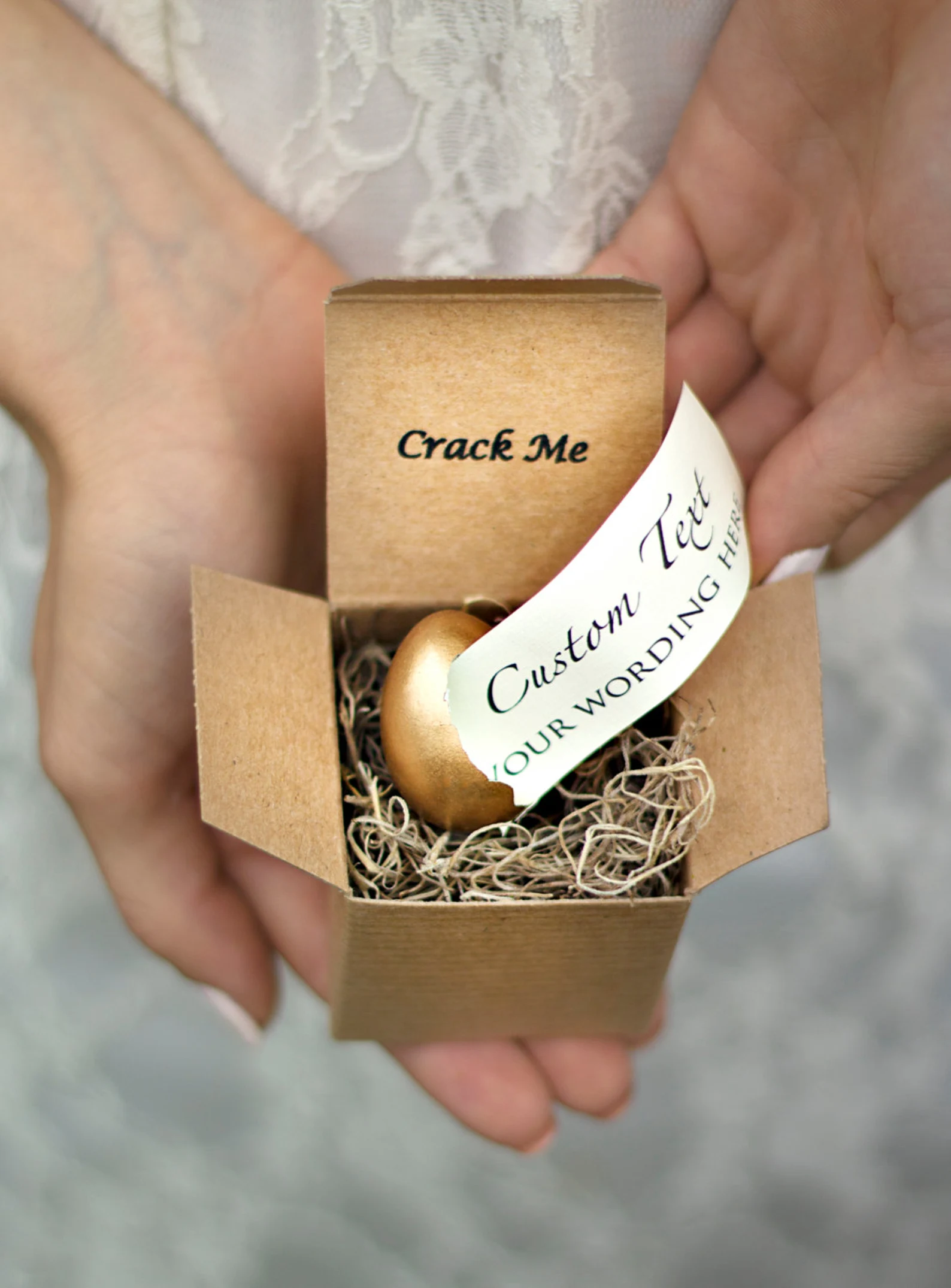 Pregnancy announcement to parents gift box with a crack and reveal message in an egg.