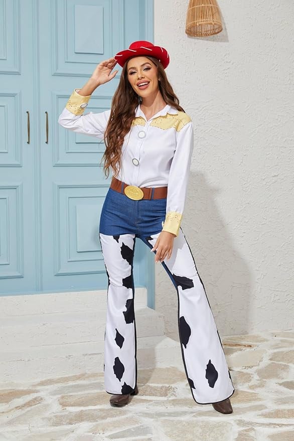 Woman dressed as Jessie from Toy Story in a cowgirl Halloween costume featuring cow-print pants, white and yellow western shirt, red hat, and gold belt buckle standing in front of a blue door