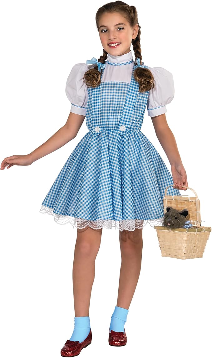 Girl wearing a classic Dorothy costume from The Wizard of Oz with a blue gingham dress, white blouse, red ruby slippers, and a basket holding Toto