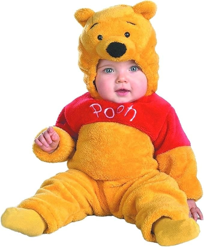 Adorable baby in a plush Winnie the Pooh costume with yellow and red fuzzy fabric, bear ears, and ‘Pooh’ embroidered on the chest — perfect for a baby-friendly Halloween or family Hundred Acre Wood theme