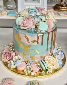 Gold drip gender reveal cake
