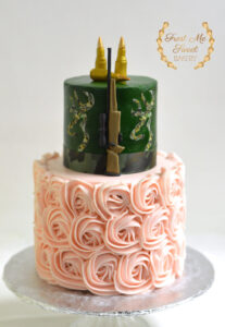 Rifles or roses gender reveal cake