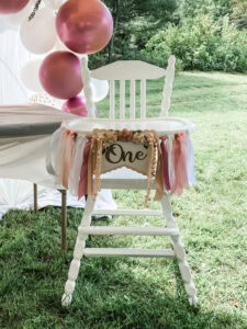 White wooden first birthday highchair