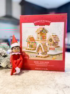 Elf brings a gingerbread house