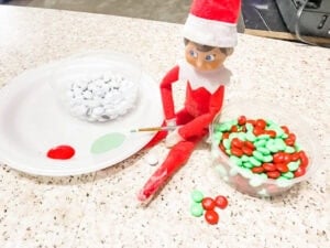Scout elf painting m&ms