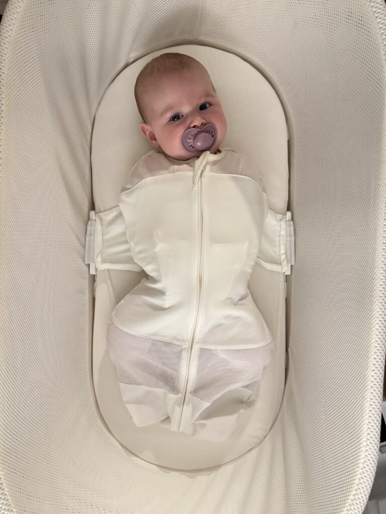 Vanessa in her SNOO Bassinet at 6 months old