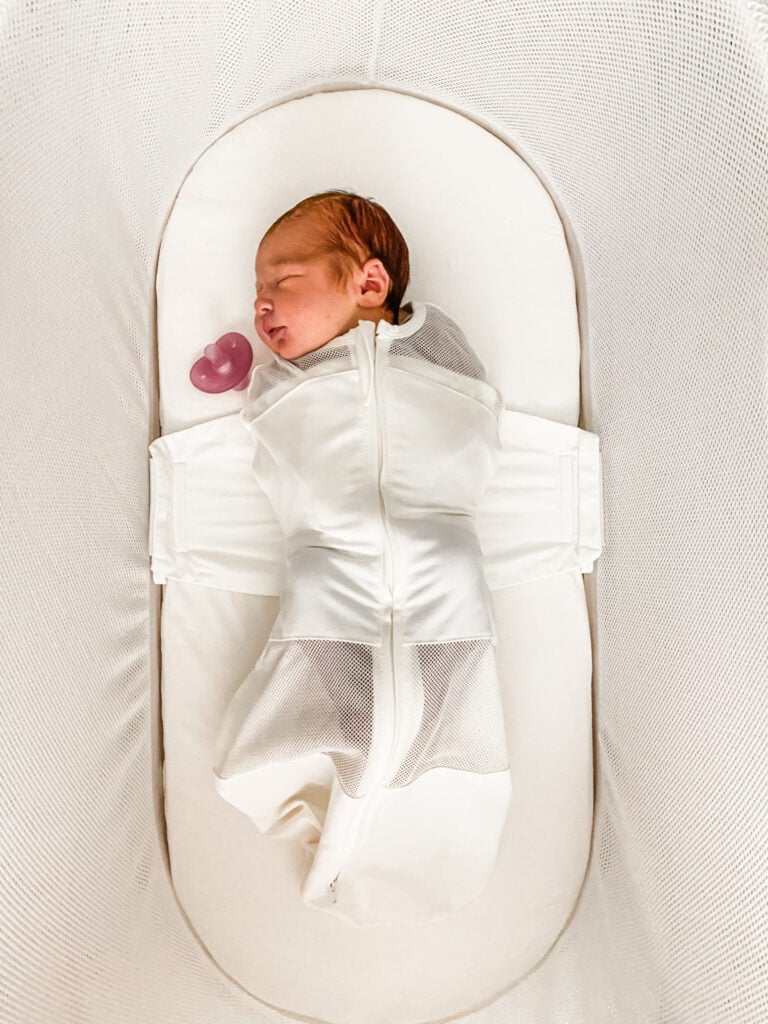 Vanessa in her SNOO bassinet as a newborn