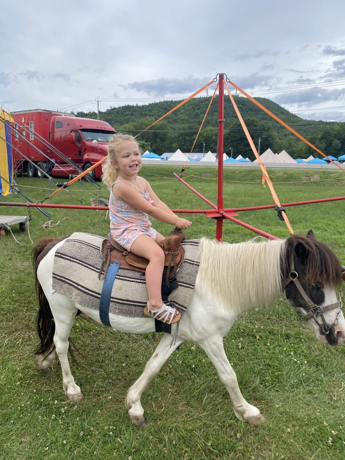 Girl riding a pony at the circus
