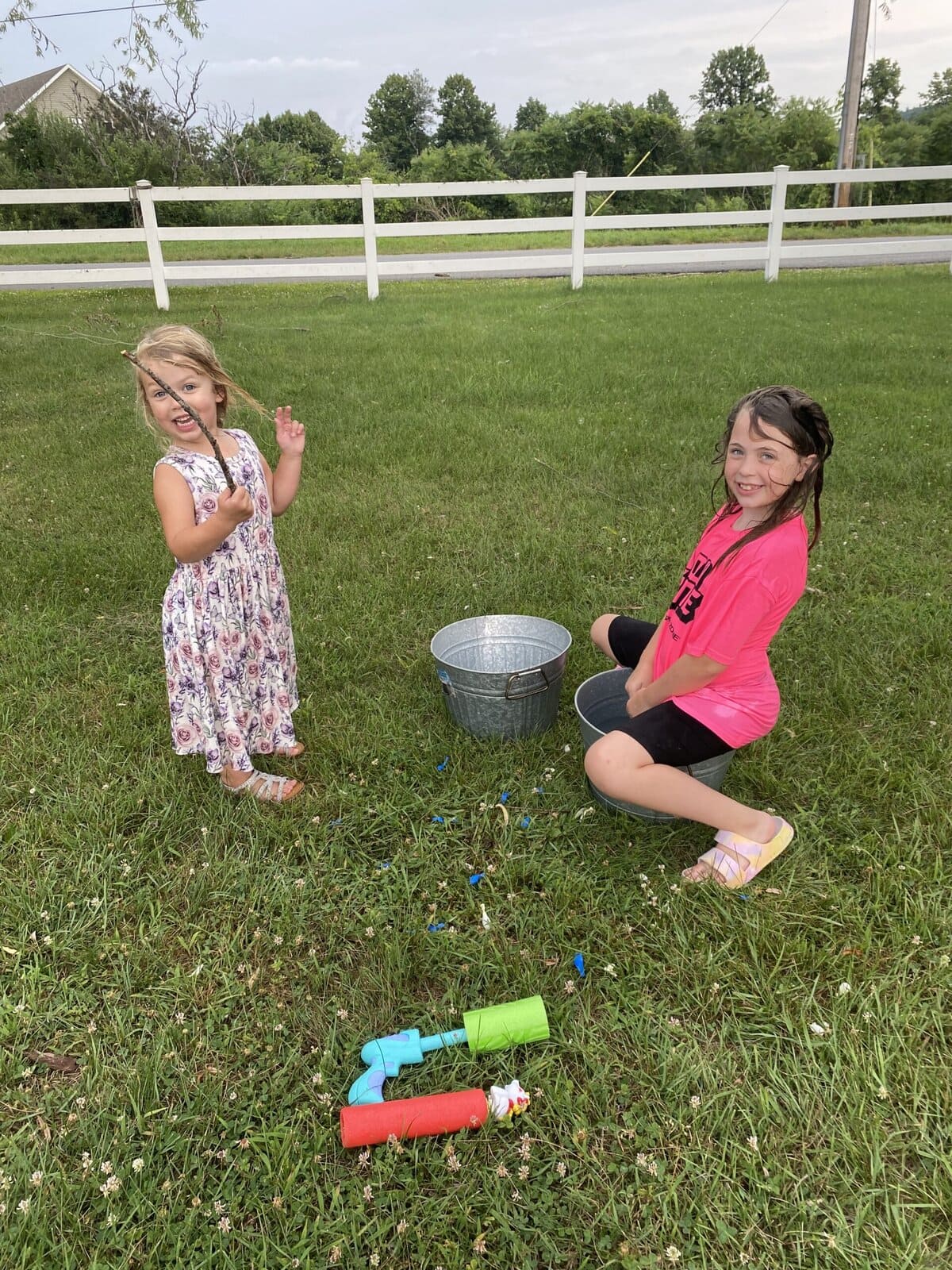 Girls all done finishing a water gun fight.