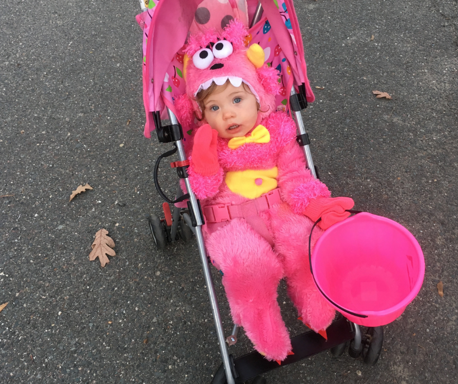Monster baby girl Halloween costume on girl in stroller