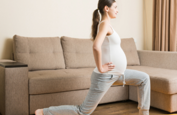 Woman staying fit during pregnancy with exercise