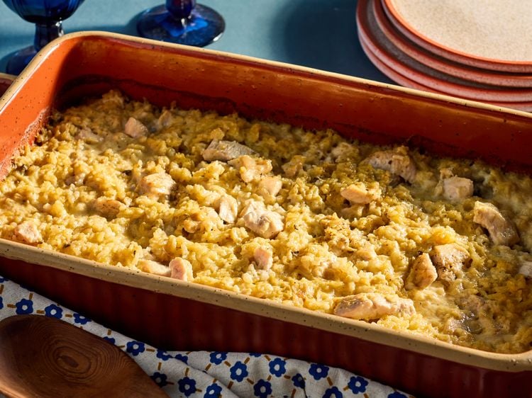 Oven baked chicken and rice casserole in baking dish ready to serve.