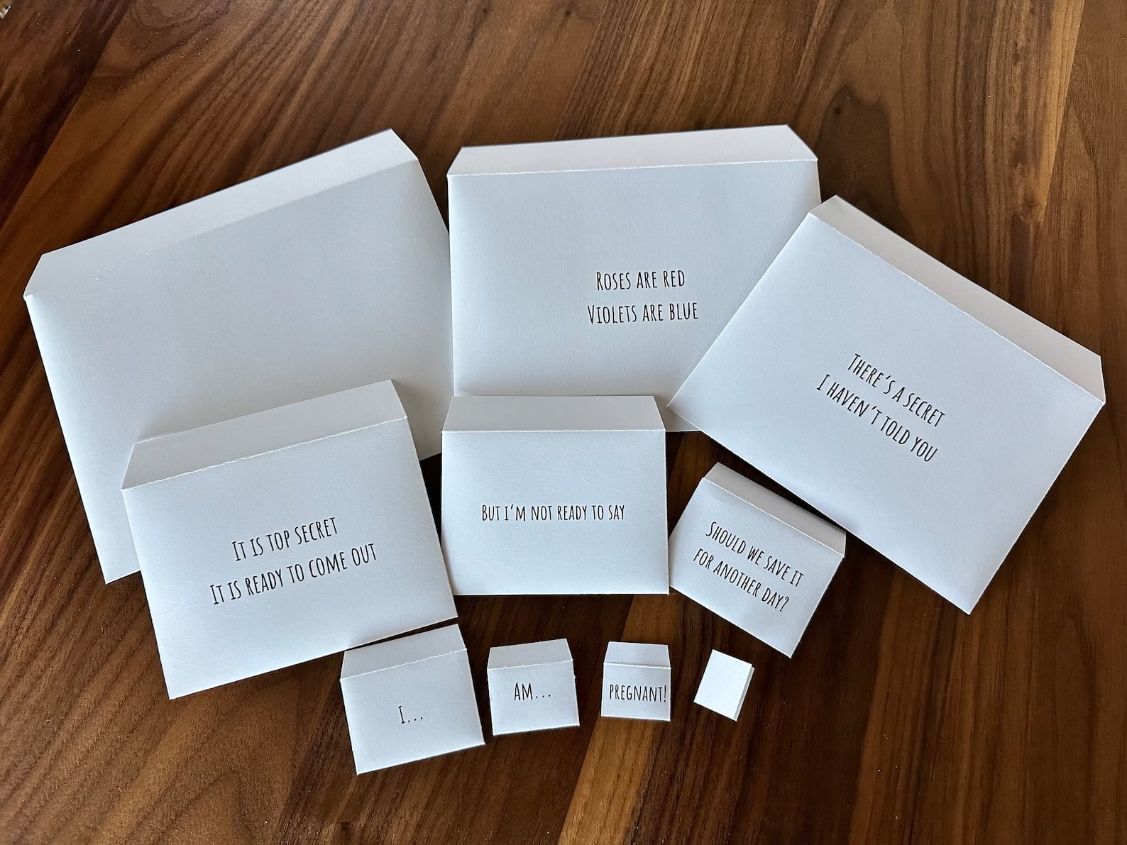 Ten pregnancy announcement nesting envelopes