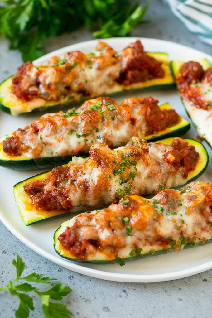 Low carb zucchini boats stuffed with ground beef and topped with melted cheese, gestational diabetes dinner idea.