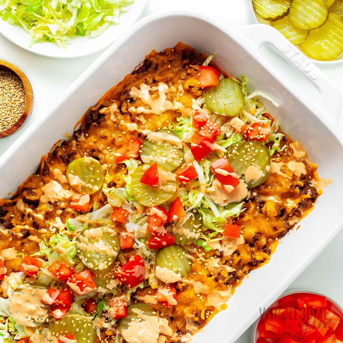 Low carb Big Mac casserole with ground beef, melted cheese, lettuce, pickles, and sauce, gestational diabetes dinner idea.