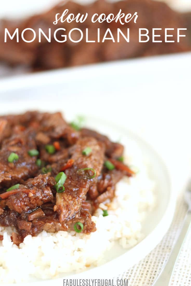 Slow cooker Mongolian beef served over white rice and topped with green onions.
