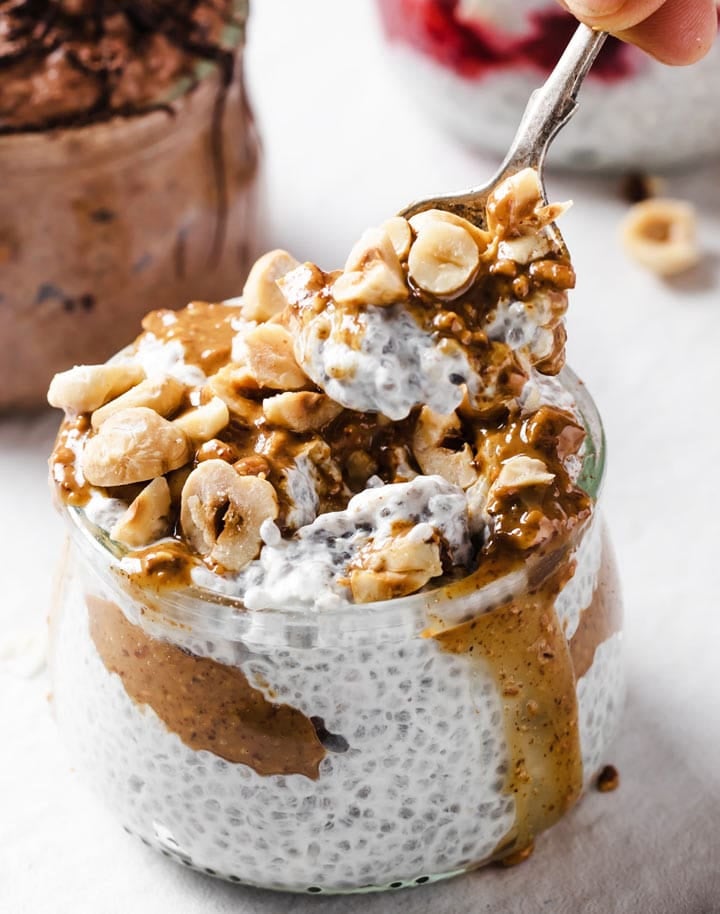 Easy gestational diabetes breakfast consisting of creamy chia seed pudding topped with almond butter and chopped nuts.