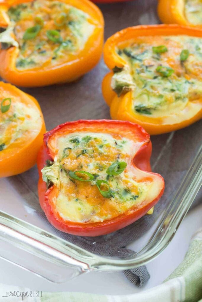 Easy gestational diabetes breakfast consisting of bell peppers stuffed with eggs, spinach, cheese, and green onions.