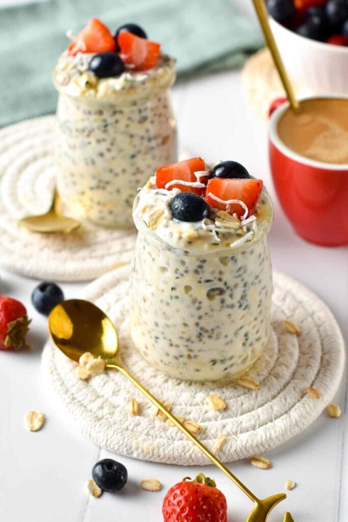 Easy gestational diabetes breakfast consisting of creamy overnight oats with chia seeds, strawberries, blueberries, and shredded coconut.